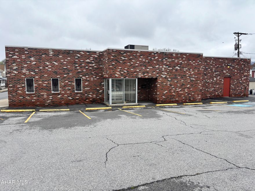 Commercial building on a traffic controlled corner across from UPMC Altoona Hospital. High traffic flow and visibility. Exhaust hood and two walk-in coolers included (functionality not guaranteed). Call listing agent for more details and to view the space.