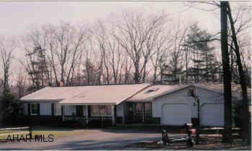 Lovely Brick/Vinyl Rancher Large deck, central air, paved drive, sun room with pellet stove.