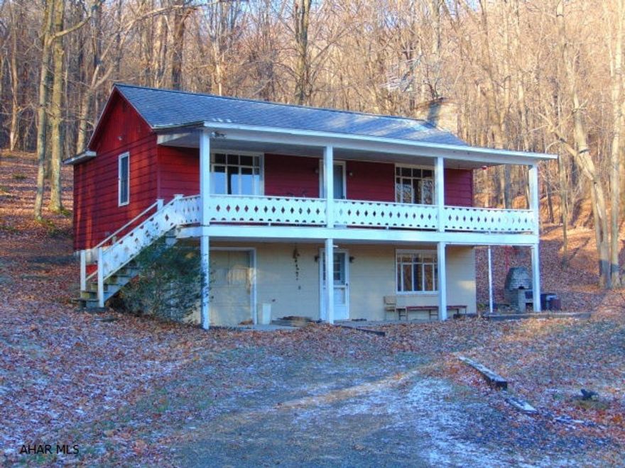 Ultimate in privacy, wildlife, and hunting opportunities.  The barn is equipped with a workshop, bathroom, and plenty of storage space in the loft.  The raised ranch is set up as a cozy summer retreat, which also includes a separate guest house with newer windows.  Picture yourself floating on the peaceful pond, or hiking through the surrounding dense forest.  This 129 acre property is full of endless possibilities.