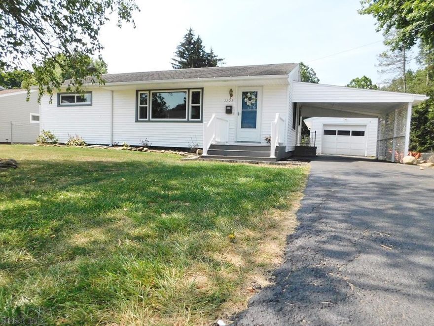 This 3BR is situated on a nice flat fenced lot in a quiet neighborhood.  It offers a set garage as well as a carport for rainy days.  Hardwood floors throughout.  Window World windows with transferrable warranty.  New kitchen and updated baths.  Lots of extra living space in lower level and good storage as well.