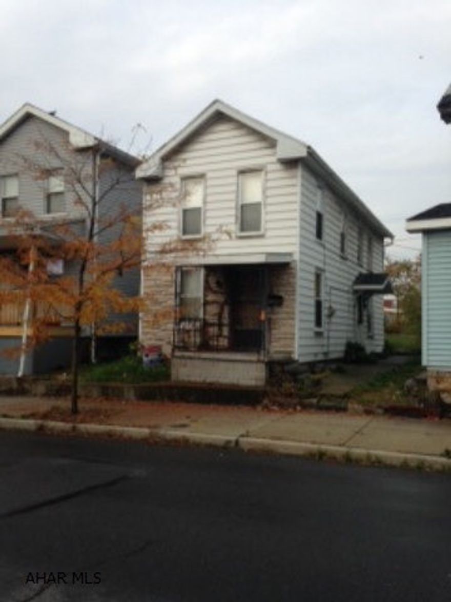 Off-street parking in rear.  Electric baseboard heat in bedrooms.  Gas heaters on first floor.  Great for the investor!