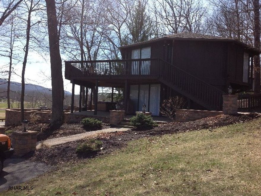 THIS TOPSIDER OVER LOOKS OMNI BEDFORD SPRINGS REPORT GOLF COURSE AND HAS A FABULOUS VIEW. IT IS TURN KEY AND MOVE IN READY.ALSO OUTDOOR FURNITURE ,GRILL, NEW HOT TUB, INCLUDED.HAS THREE OFF STREET PARKING SPACES AND A OVER SIZED SPACIOUS CORNER LOT.