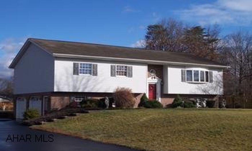 Raised ranch is located close to town in a nice housing developement.  Large rooms. An oak kitchen with a pantry cabinet, dishwasher, refrigerator, stove and garbage disposal. Cathedral ceilings, skylights, two car integral garage and a paved driveway.