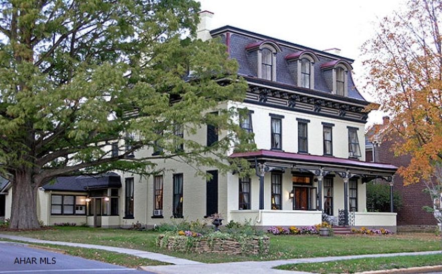 Magnificent Second Empire Style home located in the heart of downtown historic Hollidaysburg. There are 8-9 bedrooms, 9 bathrooms, 5 fireplaces, 43 custom window treatments, carriage house, 4 - car garage, picket fence and more. Seller requests that NO ONE contact her by phone or in person regarding the sale of her home, please. Qualified Buyers Only!  Call for details and data sheet.