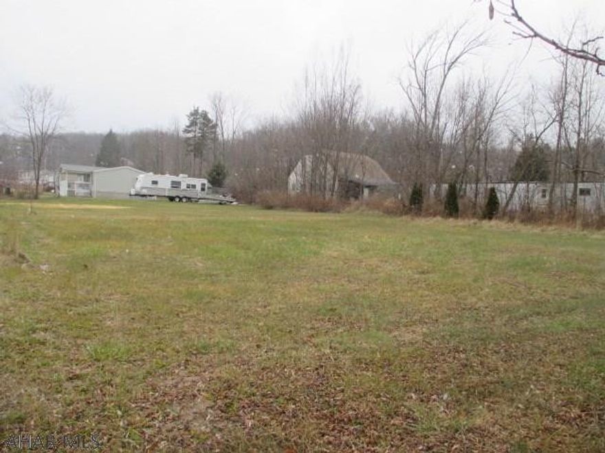 Why pay lot rent when you can own your own ground? Doublewides and modulars accepted! Bellwood school district. Large level lot. City water and city sewer on lot. Must pay to tap on.