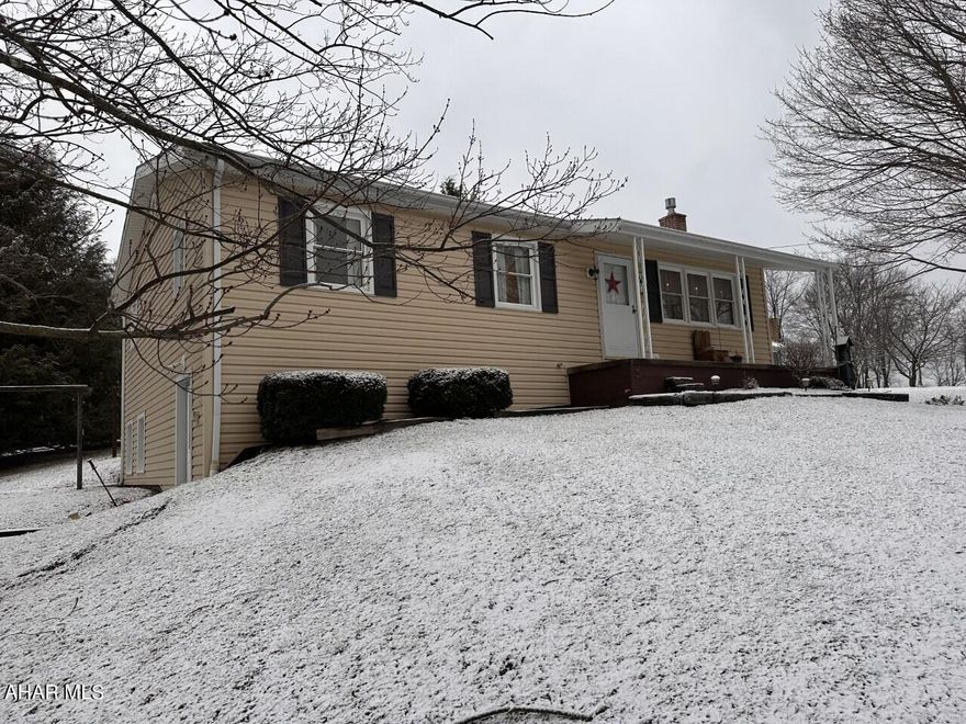 Central Cambria Schools -Jackson Township- 3 Bedroom, 1 3/4 Bath vinyl sided raised ranch home on approx. 1 acre.  Updated windows & roof.  Finished basement with family room, Laundry/bath, and kitchenette.  Propane stove included as well as all appliances.  Large rear deck.  2 Car detached garage.  A must see at $189,900.