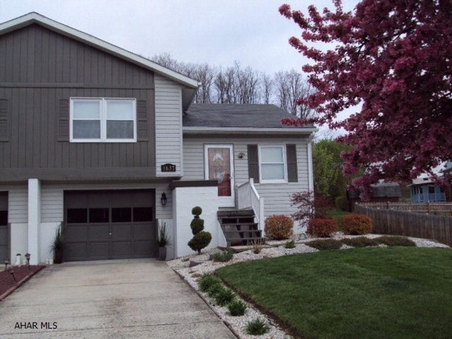 Nicely remodeled. Newer custom kitchen. Hardwood floors through living room hallway and both bedrooms. Finished room in lower level. Screened in rear patio. Tastefully landscaped.