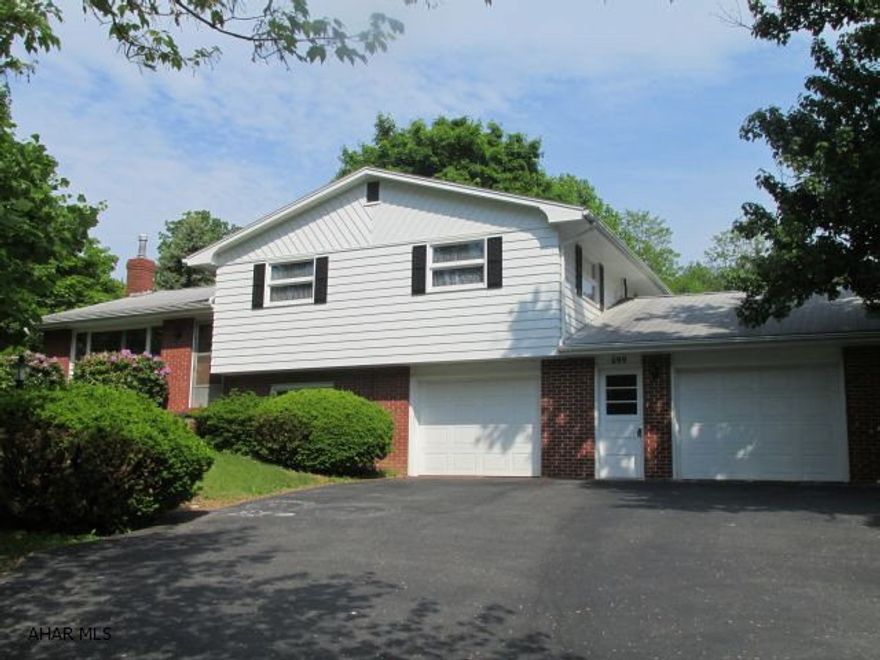 Cozy split level - .749 acre lot, private, brick and wood exterior, plaster walls, owned water softner, sump pump in basement, 2 - 100 amp breaker panals, berber carpet in family room, rear enclsoed screened porch, central air.