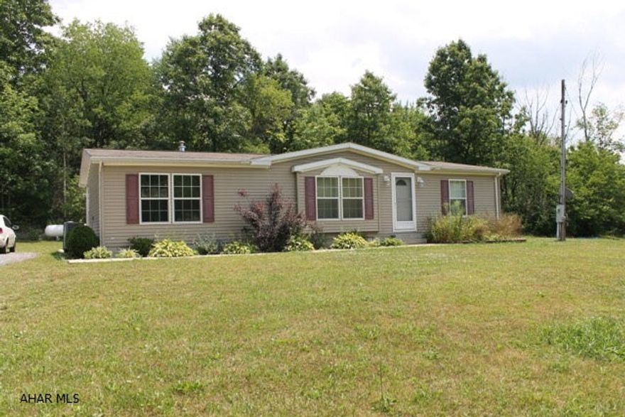 Beautiful setting on 4.98 acres in Bellwood School District. Large pond and wooded area. Ground to left of home has a extra well and septic. 3 Bedroom, 2 bath home with crawl space, Geo-thermal heating system with C/A. Private and secluded.