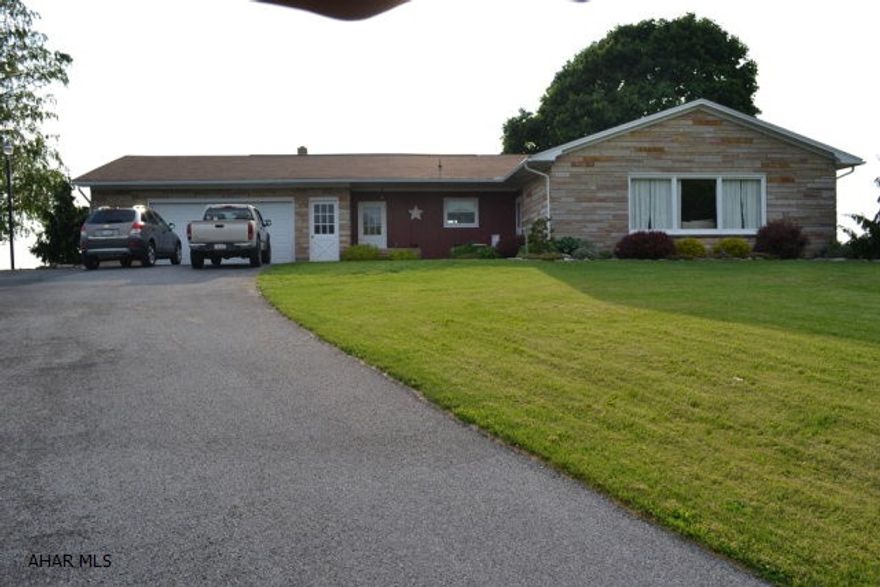 Well built ranch style stone home with updated windows and a great yard. The views are stunning! Paved drive and close to Rt 70 and PA Turnpike. Home has 3 heat sources and 2 car garage with above head storage.