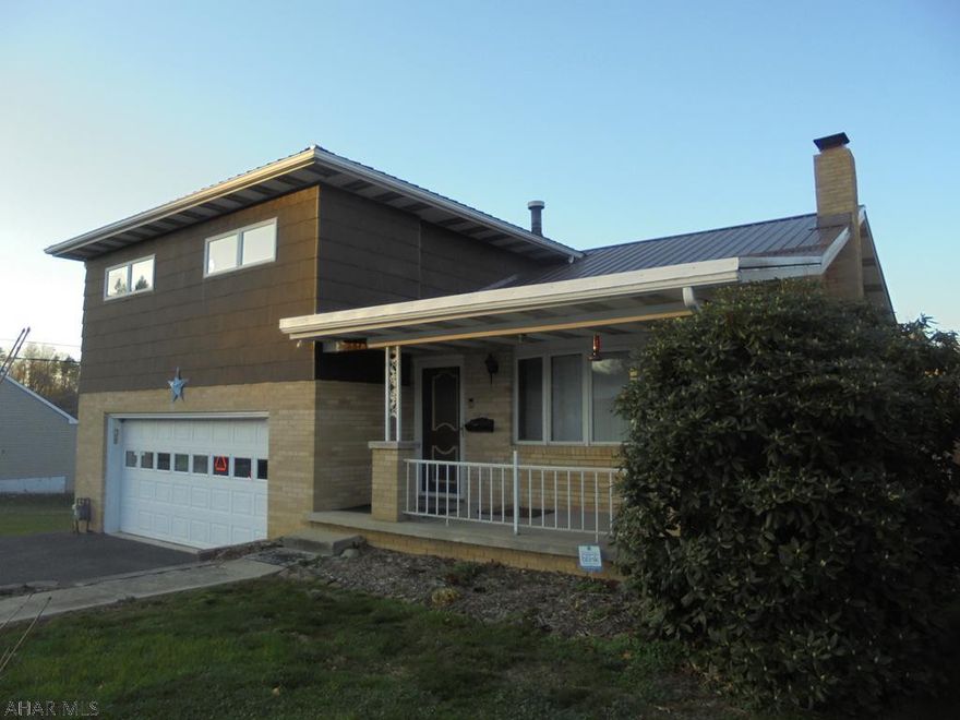 Ebensburg- 4-5 BR, 3 bath split level brick & frame home on double lot. Gas HW baseboard heat and central air. 2 car Integral garage. Newer metal roof.  Backup generator and appliances included.