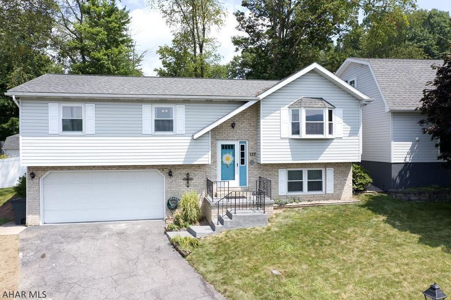 Very unique 4 bedroom bi-level home located in the Bellwood Antis School District! This home features an attached 2 car garage and an oversized detached garage with its own separate driveway. Above the detached garage is a living space with a half bathroom and a kitchenette.  The detached garage has its own HVAC system with central air. Inside the home on the lower level you will find 1 full bathroom, an oversized bedroom with a quaint fire place, and a laundry room.  On the upper level you will find a full bath with a sky light, 2 bedrooms, and a master bedroom with a full bath.  There is an open concept kitchen, dining room, and living room. In the back of the home there is a spacious deck and fenced in yard providing plenty of privacy and space to relax outside.