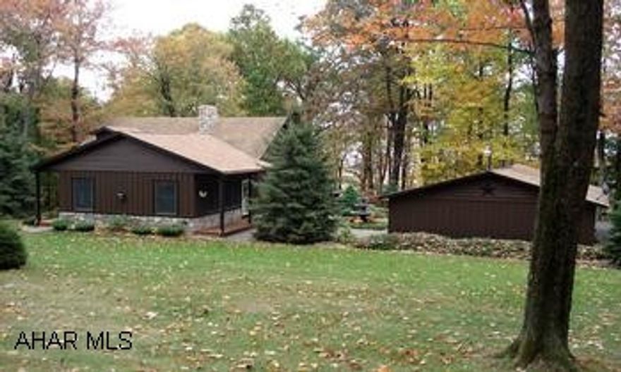 Gently sloping lot w/ 5 acres wooded and 5 acres improved w/ professional quality landscaping, great views, midway between Bedford and Johnstown and within 0.5 miles from State Game Lands. Hemlock siding, Anderson windows, oak kitchen cabinets w/ newer appliances, stone propane f/p, finished bsmt w/ fam room and 3/4 bath. One car plus detached garage w/ work area and finished bonus area.