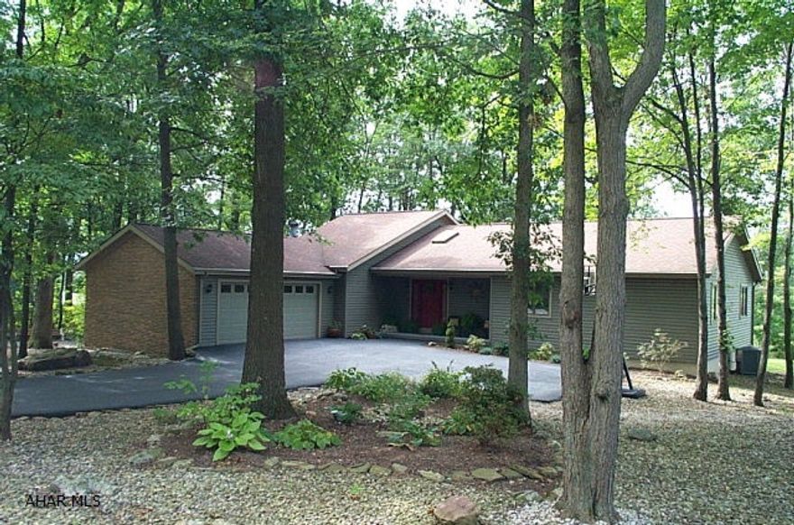 Spacious One Story On Wooded Lot In Stonehedge, Vaulted Wood Ceilings, Open Architechture, Private Deck And Screened Porch, Dual Driveway Access, Decorated Beautifully.