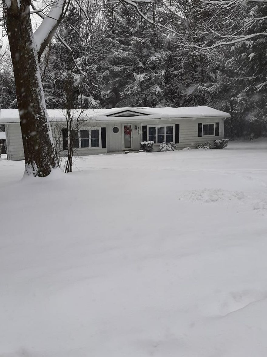 Your new home " in the woods"  is awaiting! Walk into the welcoming foyer straight into the galley kitchen with granite countertops and updated appliances. Use one of 2 dining areas, and relax in the spacious living room. Master bedroom and master bathroom on one end of the home with 2 more bedrooms and full bath at the other end. Plenty of storage throughout. Bar room/family room in lower level. Storage and utility room with walk out in the unfinished side of basement. Very nice setting for this updated home. Call for your showing today!