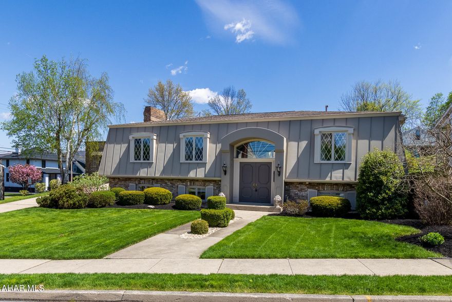 Custom Designed, Custom Built all Brick Home in Hollidaysburg Borough!  

This Amazing 3739 Sq FT Home is one of the most Unique Properties in the Borough and sits on a 100 x 150 lot Featuring Beautifully Groomed Grounds and Mature Landscaping. There are 4 Large Bedrooms and 2 ½ Baths. The Entrance Foyer is a Sight to see Inside and Out. The Exterior Arch at the Front Door is Made of Solid Reinforced Concrete! Just Beautiful. The Entrance Foyer gives Quite the First Impression for all who enter. There are 4 Large Bedrooms and 2 ½ Baths.  The Kitchen includes all Appliances, Plenty of Room for Everyday Eating for your Family, a Convenient view of the Patio and Back Yard and A Huge Pantry.  The Formal Dining Room, and Formal Living Room are sure to please for Entertaining Special Guests and Family Members.  

The 30 x 21 Family Room is just off the Kitchen and Features a Huge and Impressive Brick Fireplace. Plenty of Room for your Family and Friends to Gather. Pool Table? Ping Pong Table? Sure! There is Room for that! There are Double Doors to the Patio that will just Increase your Entertaining Area as well.  

The Owners Bedroom Has a 10 x 7 Walk in Closet with His and Her sides! Full Bath as Well. The other 3 Bedrooms all have Large Closets. A 2nd Full Bath is Located nearby.  

The Outside of the Home is Lovely. The 595 Sq Ft Patio is Amazing. Off the Patio is an 1124 Sq Ft Carport/Garage that will Accommodate 3 Cars.  

The Exterior Walls of the Lower Level are Built with Reinforced Concrete. There are Two 200 Amp Services. The Roof was Replaced in 2016. Exterior Trim Painted in 2023. All Mechanics are Solid.  

Custom Designed, Custom Built all Brick Home in Hollidaysburg Borough!  

This Amazing 3739 Sq FT Home is one of the most Unique Properties in the Borough and sits on a 100 x 150 lot Featuring Beautifully Groomed Grounds and Mature Landscaping. There are 4 Large Bedrooms and 2 ½ Baths. The Entrance Foyer is a Sight to see Inside and Out. The Exterior Arch at the Front Door is Made of Solid Reinforced Concrete! Just Beautiful. The Entrance Foyer gives Quite the First Impression for all who enter. There are 4 Large Bedrooms and 2 ½ Baths.  The Kitchen includes all Appliances, Plenty of Room for Everyday Eating for your Family, a Convenient view of the Patio and Back Yard and A Huge Pantry.  The Formal Dining Room, and Formal Living Room are sure to please for Entertaining Special Guests and Family Members.  

The 30 x 21 Family Room is just off the Kitchen and Features a Huge and Impressive Brick Fireplace. Plenty of Room for your Family and Friends to Gather. Pool Table? Ping Pong Table? Sure! There is Room for that! There are Double Doors to the Patio that will just Increase your Entertaining Area as well.  

The Owners Bedroom Has a 10 x 7 Walk in Closet with His and Her sides! Full Bath as Well. The other 3 Bedrooms all have Large Closets. A 2nd Full Bath is Located nearby.  

The Outside of the Home is Lovely. The 595 Sq Ft Patio is Amazing. Off the Patio is an 1124 Sq Ft Carport/Garage that will Accommodate 3 Cars.  

The Exterior Walls of the Lower Level are Built with Reinforced Concrete. There are Two 200 Amp Services. The Roof was Replaced in 2016. Exterior Trim Painted in 2023. All Mechanics are Solid.  

An Incredibly Special and Unique Home!
