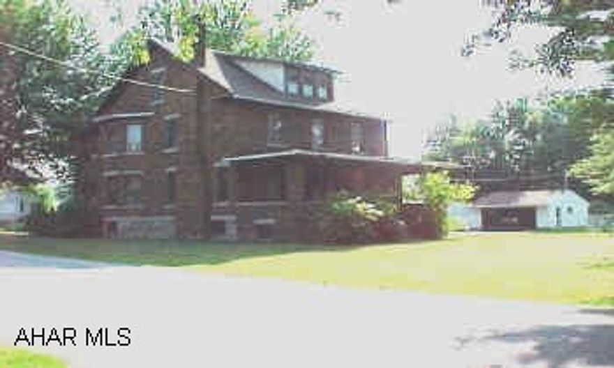 Home needs completely remodeled but has a nice floor plan.  Sale includes an additional lot with two car garage across the street.  Lots measure 50' x 120' and 189' x 169'