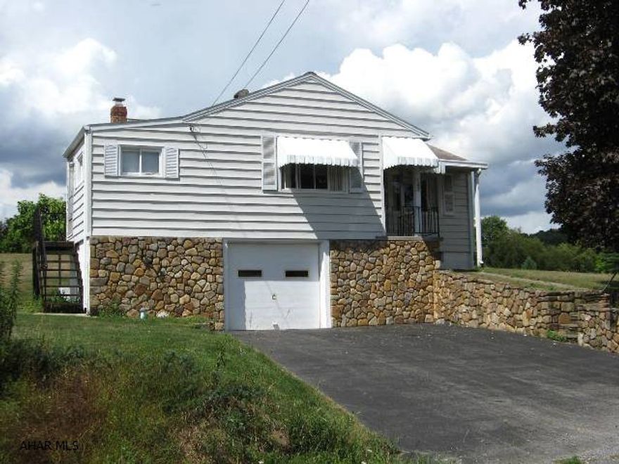 This adorable home is situated on a spacious 1.5 acres with shed, integral garage, additional 1-car garage and small barn.  There's lots of room to enjoy the outdoors with this property.