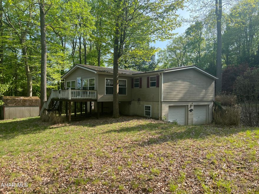 1994 doublewide on a large corner lot. This home features 3 bedrooms, 2 baths, nice kitchen, living room and a florida room addition. Full basement with some finish. Two integral garage. Decks and storage shed. Located in Glendale Yearound, a gated community near Prince Gallitzin State Park.  Great home for the $$.