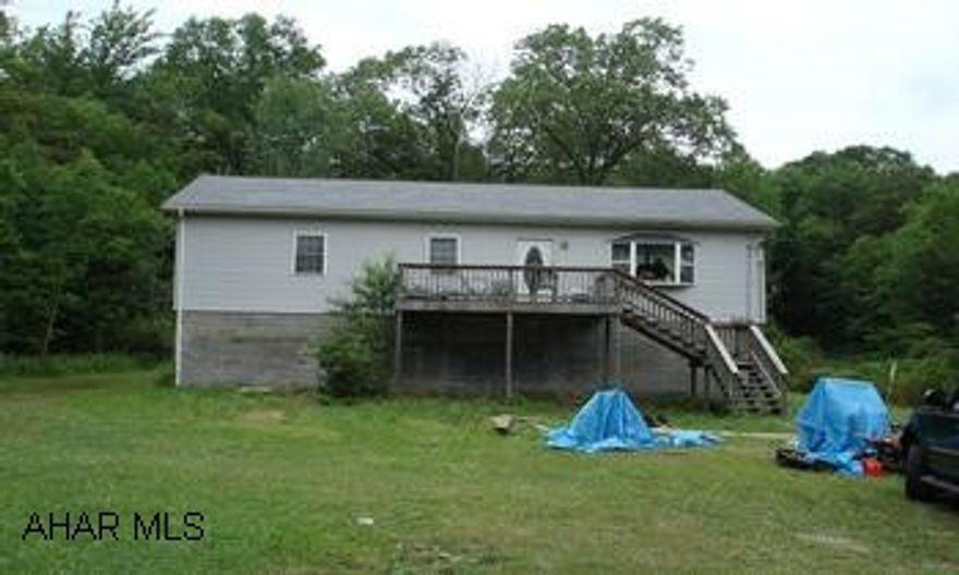 Rancher with newer roof, windows and vinyl siding.  Needs a lot of interior work.
