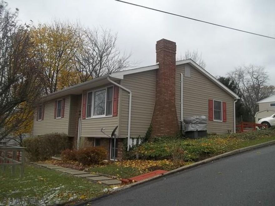Breath taking view of the city from the huge window in the living room! This is a split entry home in a tremendous area. This home features 3 bedrooms and 2 baths that is move in ready. A large wrap around deck that gives this home a special feel and outstanding views of the mountains of PA. The finished basement is a great place for entertainment with a bar area and a wood fire place. This home offers a newer furnace, siding, hot water tank, central air unit, and off  street parking. This home has it all! Great price, great location, and great views! Call me to set up your showings today!