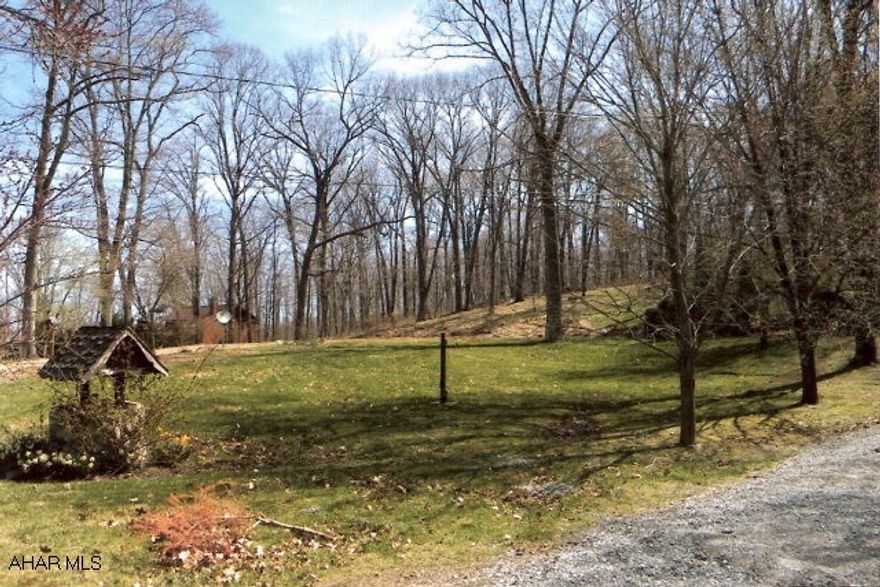 Great wooded building site.  Well and septic on site, mature trees, some fencing.