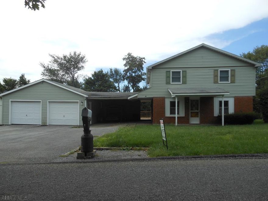 Nice well cared for house on a quiet street in Carrolltown. Large 2 car detached garage with breezeway connecting to the house. Nice open floorplan. Good flow from room to room. Main floor features a family room, living room, kitchen, dining room and laundry room with 1/2 bath. The second floor has four bedrooms and a full bath. All upstairs rooms have hardwood floors. New flooring in the dining room and kitchen. Exceptional bargain. Large 80x150 lot. Prior to setting up a showing, buyers must present a prequallification letter for a conventional loan.