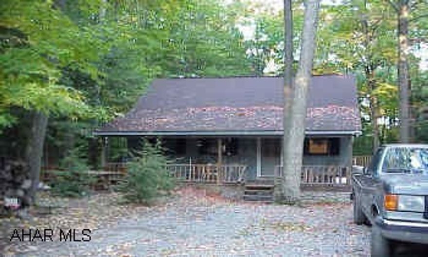 Glendale Yr Round - Private setting on .95 acre - 3 bedroom and 1.25 baths.  New family room with gas fireplace, hot tub, dry bar, and tile floor.  Finished basement with a bedroom and workshop. Heat:  Electric baseboard, gas wall furnace in the basement, and a gas fireplace.