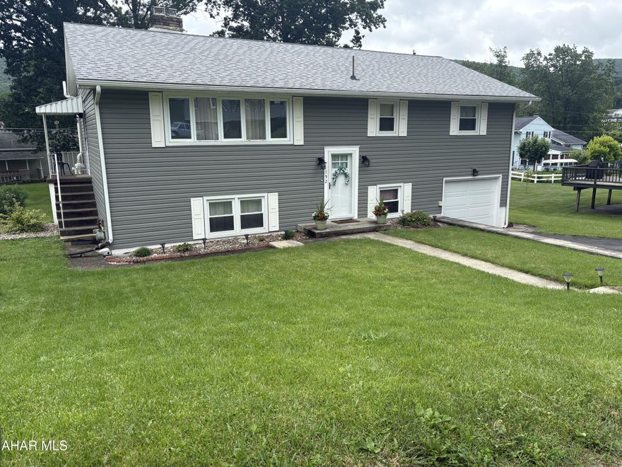 Bright, fresh and clean describe this lovely home upon entry.  On the outside you will find a large, landscaped lot surrounded by well maintained homes within a small subdivision in the Greenwood area.  This lovely home has been thoughtfully updated over recent years including a new roof in 2019, new siding and doors in 2021, new heat pump and boiler in 2019 (yes there is hot water heat as well as gas forced air heat and air conditioning).  The kitchen and baths were updated in 2023 to include new counter tops and appliances.  The family room which covers nearly the entire lower level includes a wet bar and a cozy gas fireplace.  From the family room walk out to a covered patio and expansive level back yard. A laundry area is conveniently located in the large half bath on the lower level with plenty of room to add a shower or tub if you wish. 
Hardwood floors flow throughout the main living areas, adding warmth and elegance to the home's interior.
For outdoor enthusiasts or those who enjoy entertaining, the backyard provides the perfect oasis. The covered patio leads to a well-maintained lawn, ideal for hosting gatherings, playing games, or simply relaxing in the tranquility of your private retreat. Additionally, the property includes a one-car garage with extra storage and a driveway that can comfortably accommodate multiple vehicles.
With its thoughtful updates, versatile heating and cooling systems, and a seamless blend of style and comfort, this home is truly a gem in the Greenwood area. Surrounded by a friendly community and conveniently located near shops, schools, and parks, it offers a lifestyle of both convenience and serenity. Don't miss this opportunity to make it yours!