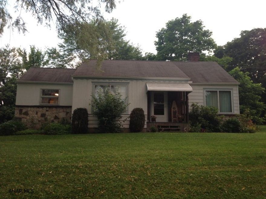 Cute ranch style home located right outside of town. Would make a great starter home. Just shy of 1 acre in a family-friendly neighborhood. Finished basement with workshop and additional living area. Two bedrooms, 1 full bath and cozy living area on main floor with grand ceramic tile fireplace.