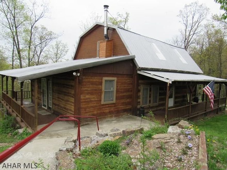 Deer, Turkey, Bear, & magnificent Ridge views are outside your front door & within close proximity to Stone Mountain State Game Lands #112 with multi-use trails. This genuine Appalachian style mountain log home is perfect for a year-round residence, Hunting or a Weekend Getaway. The home is situated on 25 acres which is partly wooded. The wrap around covered porch overlooks a variety of fruit trees, grape arbor, & garden area. There is a barbecue/picnic area for entertaining friends & family. A 2 car carport & a 2 story shop. The camp consists of a vaulted ceiling in the living room, awesome loft which is currently being used as a bedroom & office area. Off the living room is another room that can be used as a first floor bedroom. Pack your bags, bring your ATV's & get ready to move in!