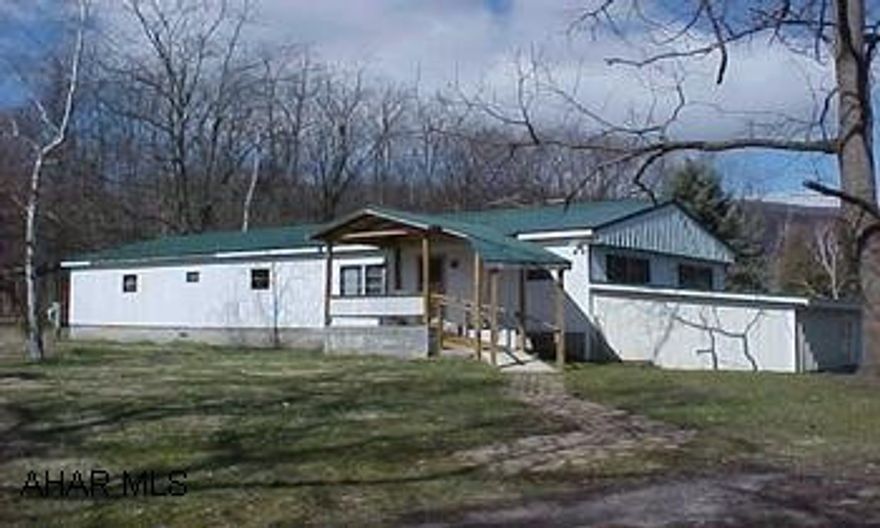 Three sheds included,  Double wide (2 singles put together) on foundation and partial basement.