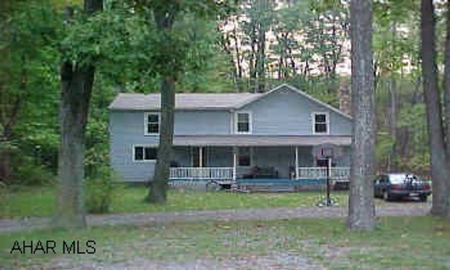 Quiet country living on .48 acre. in Sinking Valley. New furnace, new roof, beautiful stone fireplace. Interior needs TLC.