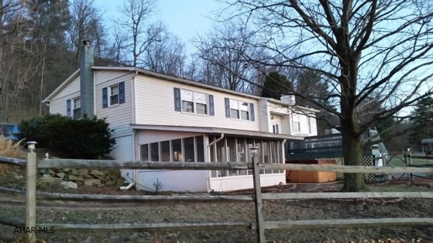 Vinyl sided 3 bedroom, 2.5 bath, bi-level overlooking Morrisons Cove with tremendous view, 2.472 acres, 36 x 40 pole building, family room with pellet stove, gas fireplace in living room, nice kitchen with island and oak cabinets, hardwood floors, ceramic tile, large patio and fire pit and screened-in porch. New furnace, new roof & central air. Close to State Game Lands. This is along Fredricksburg Mountian Road.  #J-280