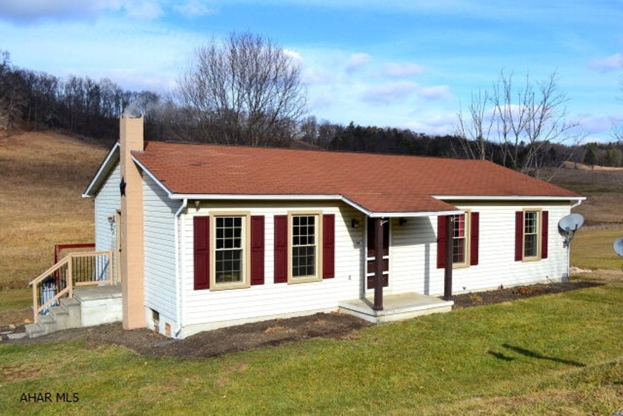 Open panoramic views from this 3 bedroom ranch home situated on a full 1 acre in Chestnut Ridge.  Updated eat-in kitchen with hickory cabinets, large living room and spacious bedrooms.  New windows and energy efficient wood/coal stove.  Yard partially fenced with small barn, back yard play equipment is negotiable.  Very clean and ready to move in.