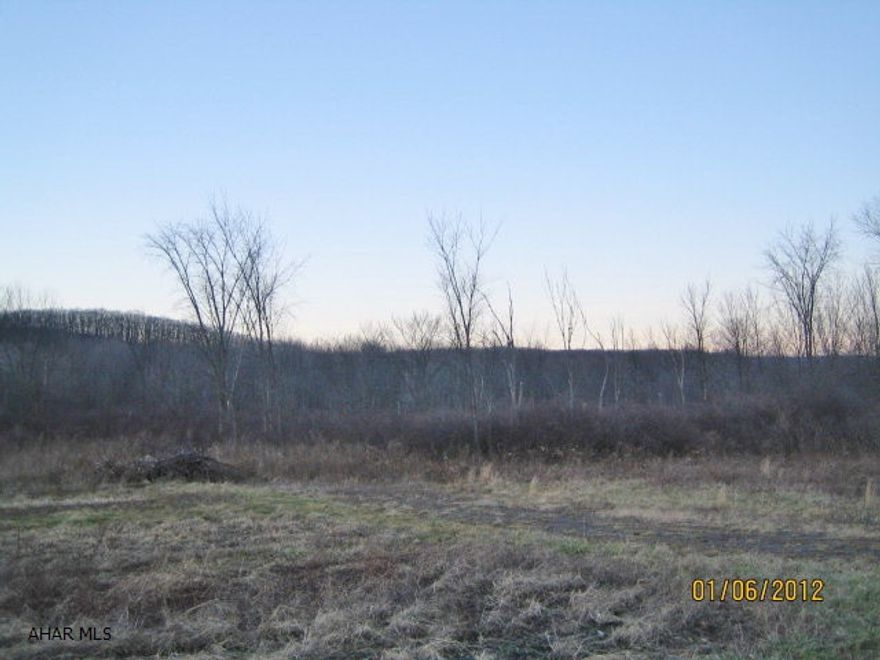 26 acres of land being sold AS-IS. Condition of property and availability of utilities is unknown.