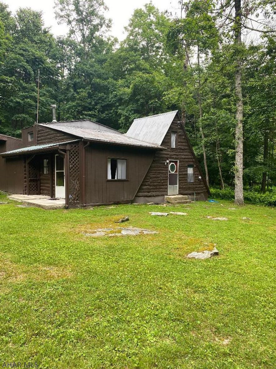 Cabin on private leased land. Great getaway! Located close to Michaux State Forest and State Game Lands. Cabin has brick hearth, large living room and kitchen / dining area. Main floor bedroom and small bedroom in the closed off loft. This cabin has no running water. There is a spring for community use. Outhouse with holding tank.