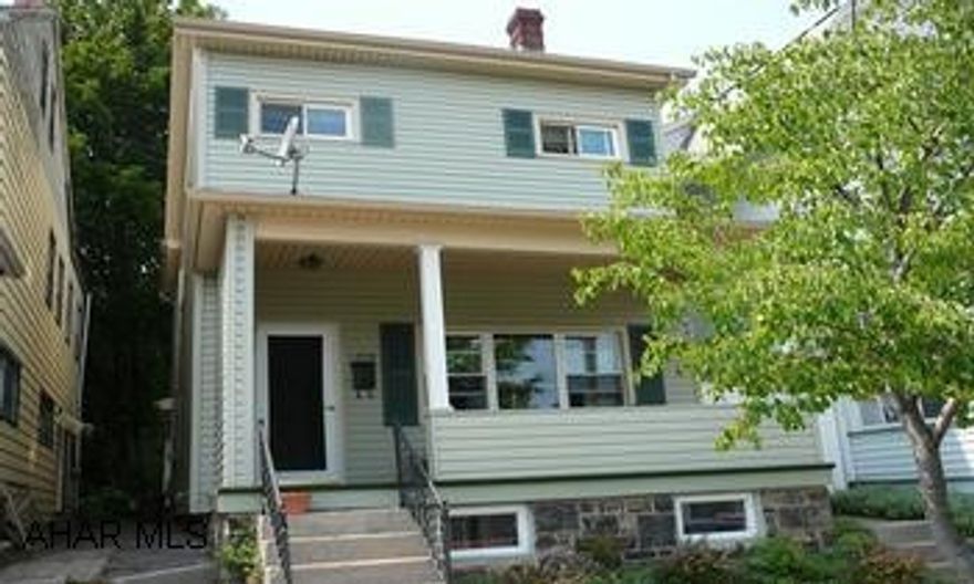 LOVELY AND SPACIOUS VINYL SIDED HOME.  WOODBURNER IN DINING ROOM.  ENCLOSED REAR PORCH.  NEWER WINDOWS, ROOF, VINYL SIDING AND FURNACE.  HOME TO THE LEFT HAS BEEN PURCHASED AND BEING REPAIRED.  LOW UTILITY COSTS.  CALL CRYSTAL 931-2470.