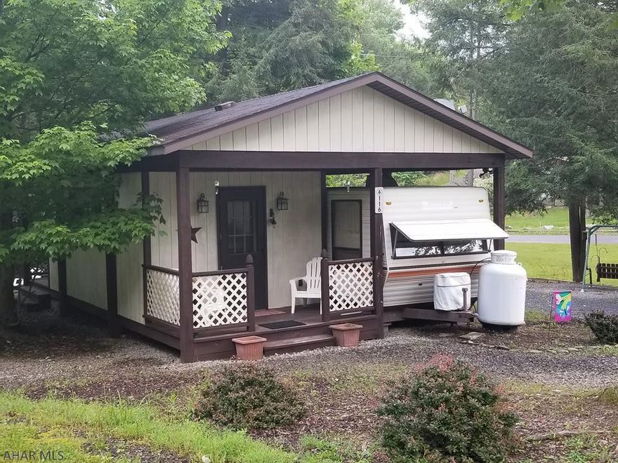 Camper with addition and pavillion on one lot in Glendale Yearound. This camp has it all. Lots of room for the whole family to visit and sleep. In addition to the bedroom, the addition comes with two futons that fold down for more sleeping space. If the night is a little chilly, fire up the propane fireplace to take the edge off. Outside, cook a hot dog or make some smores at your fire pit, have a picnic lunch at the picnic table that is nestled in next to the creek running at the edge of the campsite. A shed is included to keep your outside toys or lawn furniture. The seller is leaving most of the furniture so you are ready to pack your fishing gear and head for Glendale Lake. Your whole family will enjoy this getaway.