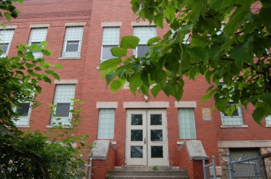 Large Building 9000+/- sq. ft. , formerly Sotto Voce Academy of Music, recital hall w/stage, lighting & sound system. hardwood floors thru out building. 6 large classrooms each w/ separate storage, 4 bathrooms. hot water gas heat,A/C, recital room has separate furnace and A/C. fenced grass area, large parking lot. 200 amp electric. Would make excellent meeting area for church, daycare, or many other uses.