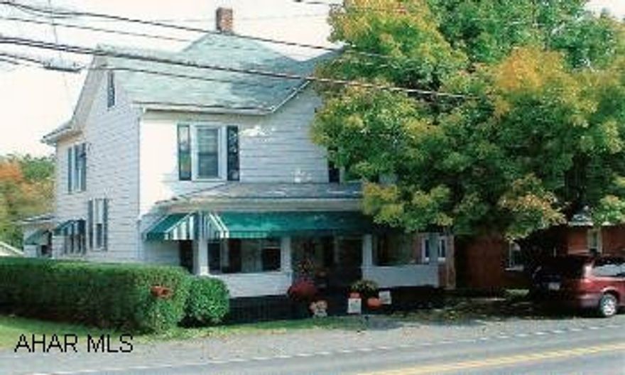 2-Story 4BR/1 3/4BA with many updates. Eat-in kitchen w/laundry and activity area plus 3/4BA. Separate oil and wood furnace. 2-car garage / workshop. All appliances including washer and dryer and 2-window AC units convey.