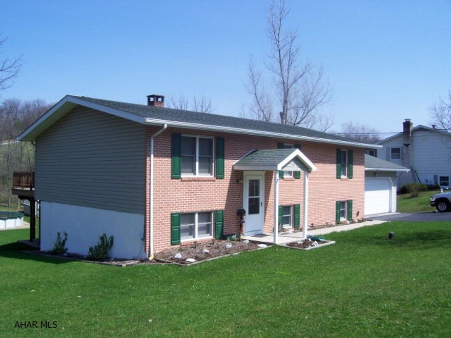 Absolutely beautiful setting--clean and neat, spacious and conveniently located.  4-5 Bedrooms- 2 Bathrooms, newer kitchen, dining room with sliders to super large deck overlooking large private lot.  Must be seen!