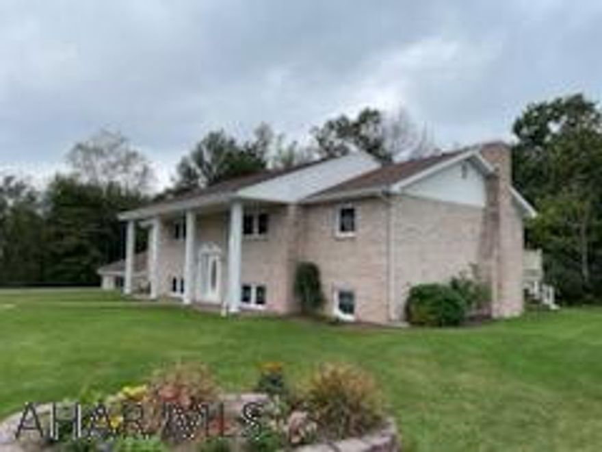 Stately brick split level home in Penn Cambria School District. Updated, carefully maintained, and move-in ready home on a wooded corner double lot. Features 3 bedrooms, 2 baths, spacious living room, large family room, and 2 car garage. A maintenance-free vinyl deck off the dining room overlooks the tree-lined backyard. Stay warm this winter with dual heat sources: auger-fed hard coal boiler and 5 zone oil boiler heats the home and garage. Plaster finish interior and brick exterior make this home sturdy and ready for new owners.