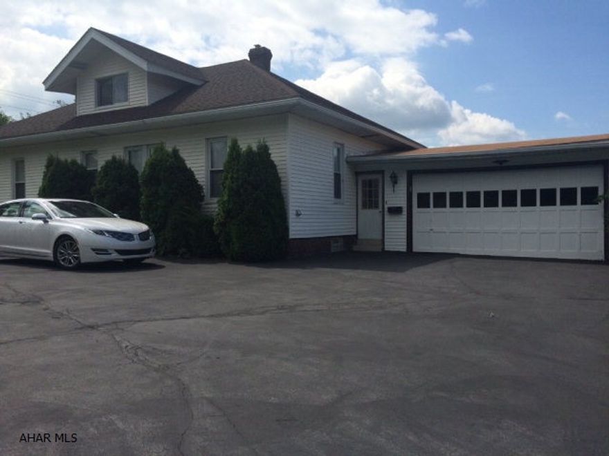 REDUCED - MUST SEE! WHY PAY RENT? Everything on one level but has a finished attic for extra bedrm or family room. Total living area of 1,935 square feet. Immaculate and Handicap accessible bath, updated and well taken care of 2-4 bedrm (3rd bed of now laundry rm off kitchen) house sits nestled on 6 tree lined city lots or .41 ac. Front porch off living room is extremely private! Convenient to shopping plaza, Juniata Car Shops, UPMC Hospital and Penn State Altoona Campus. Newer kitchen and bath as well as updated electric, newer windows, roof, furnace, gas fireplace and central air. All appliances included!  Lender qualified buyers call on this one quick to arrange for a showing.