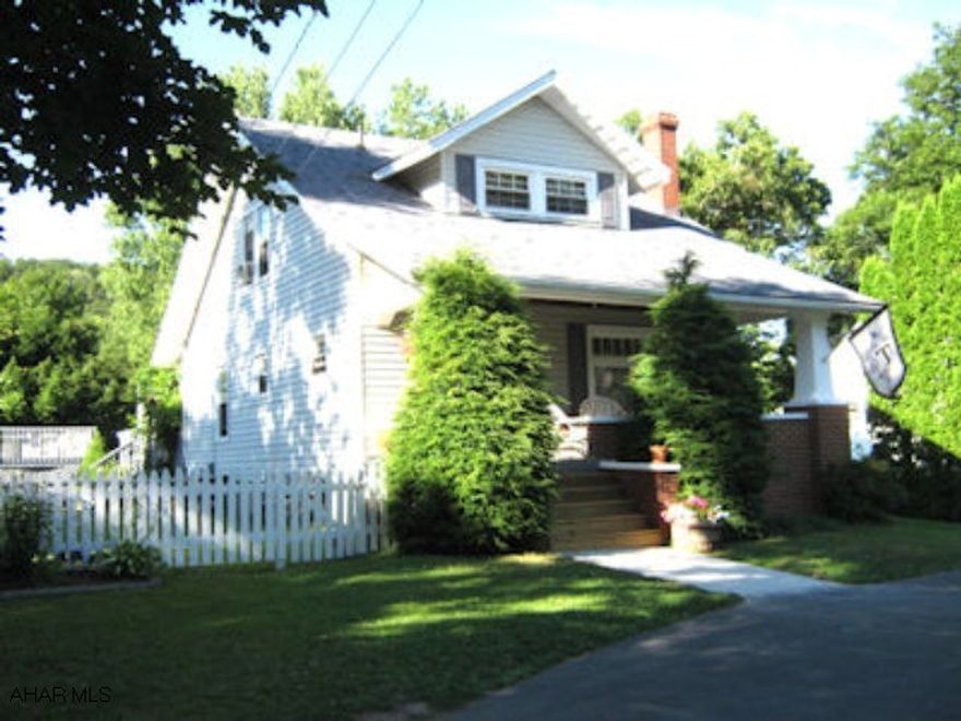 Adorable Cape Cod with newer windows, large eat-kitchen, dining room, living room with woodburning fireplace.  Hardwood floors.  Wonderful outdoor entertainment area.  Large rear deck with trellis for shade.  Above ground pool with deck. Level, fenced yard.  Circular driveway for convenience and safety.  Nicely decorated and maintained.  Don't wait too long to see this one!