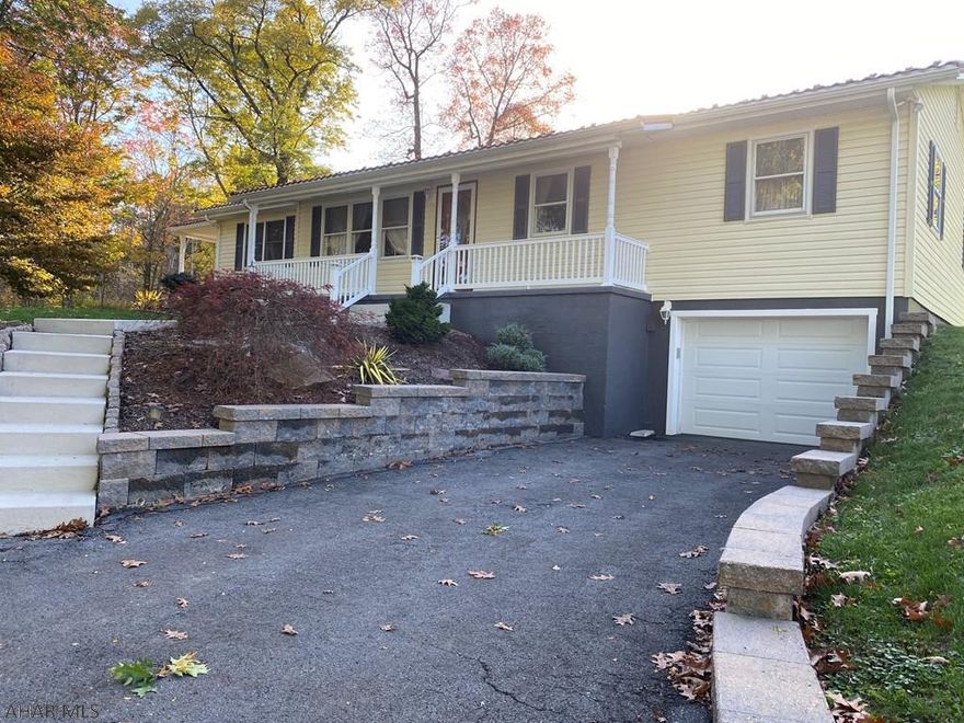 well maintained 3  bedroom 1 bath ranch style home on approx 1/3 acre lot.  This home features beautiful oak hardwood floors, oak kitchen, ceramic tile floors, new bathroom, covered patio with tiled floor, outside fireplace, hot tub,large patio, designer metal roof, full basement and one car integral garage.