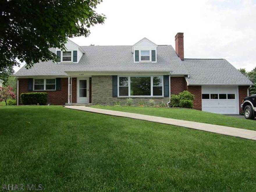 Superbly maintained brick and stone cape cod home in Meadowbrooke Terrace. The main level offers a large LR w/ picture window and wood FP, DR w/ built-in China cabinet, eat-in kitchen, two bedrooms and a full bath. Off the kitchen is a large sun porch w/ knotty pine walls. Second level offers 3-additional bedrooms, full bath and cedar walk-in closet. Full bsmt w/ family room, bar, laundry area and cold cellar. Brand new shingle roof, heat pump with central air & 200-amp electric. Beautiful lot w/ mature trees, paver edging, rear concrete patio and blacktop driveway.  Quality built home with hardwood floors, plaster ceilings/walls, plaster crown molding & oak trim. Lots of closets/storage space. If you've been searching for a nice home, this is it!!