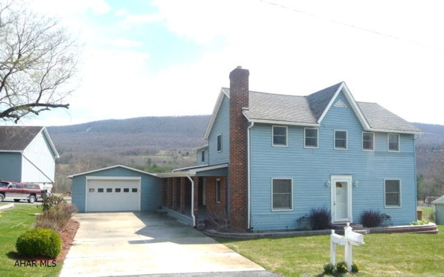 Perfect Farmette. Charming two story, remodeled home on 5.46 acres with beautiful mountain views. The property offers a large 36'x50' bank barn, a 20'x40' pole building, fruit trees and a large garden area. The two story 3 bedroom home has been updated throughout. The first floor offers an eat-in kitchen with beautiful hickory cabinets (appliances included), a formal living room and dining room, convenient laundry room and half bath. The second floor has 3 bedrooms, a bonus room and a full bath. Two porches offer country views, a child's wooden play gym and an attached two car garage with fully equipped canning kitchen complete this perfect property.