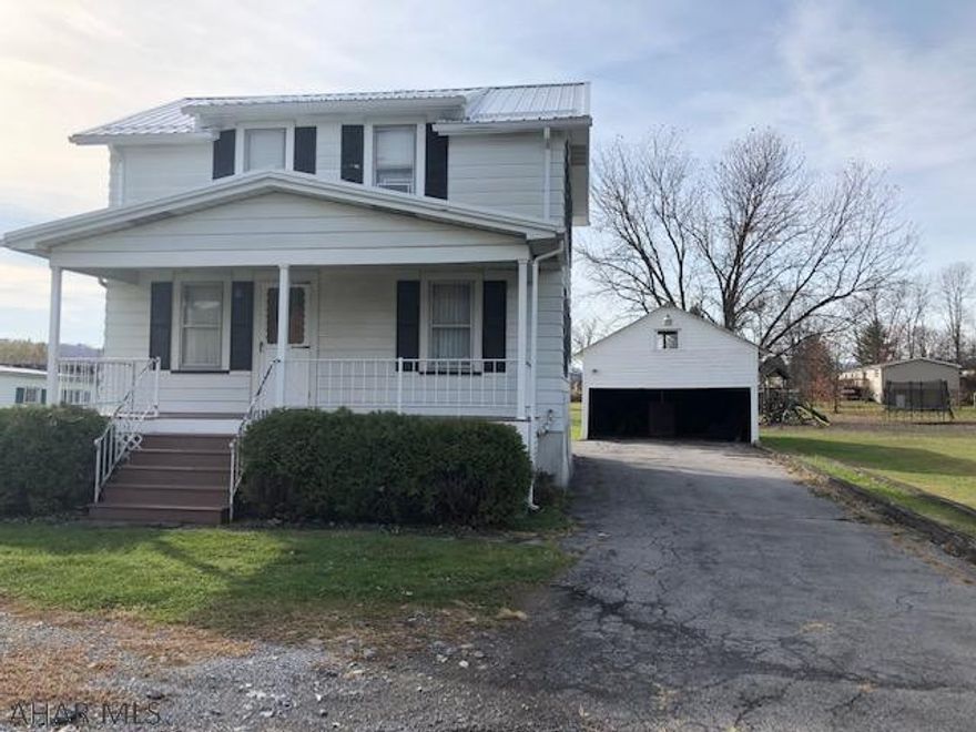 Fantastic mountain views from this 2 Bedroom 1 Bath home has good mechanics with a Rebuilt front Porch , NEW metal roof installed 2019, newer oil furnace, new well tank.  There's a large 2 car garage with a large storage loft area also being on almost 1 acre of land this home has lots of potential.  Just needs some updating inside.  Seller will make no repairs - sold "As Is"