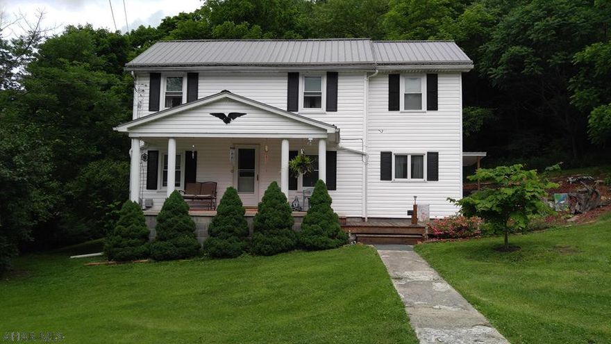 Colonial style 3 bedroom 1.5 bath home that sits quietly on 1.7 acres. This home features optional first floor laundry, newer roof, thermo pane windows, storage space, and a root cellar. The screened in back porch oversees the yard, small barn, partially wooded area, and some fruit trees.